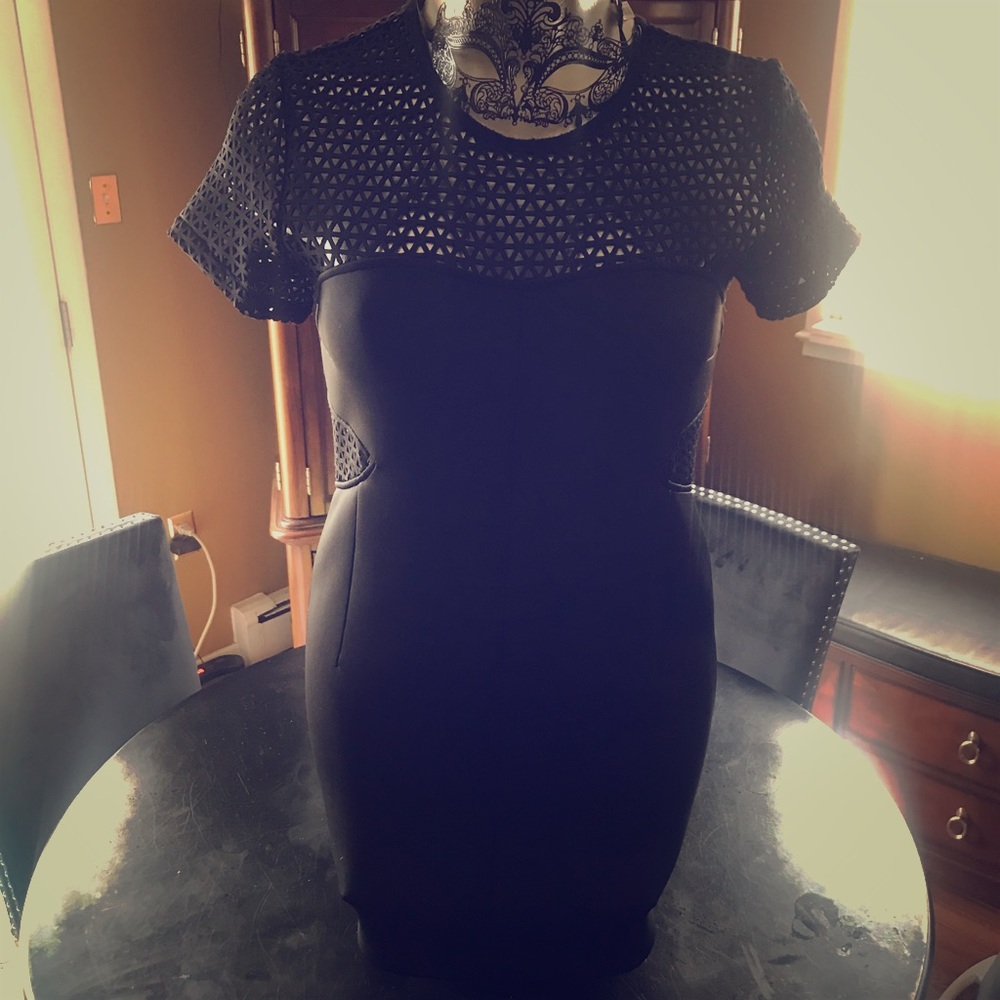 Black Mini body con net cutout dress. Club ready